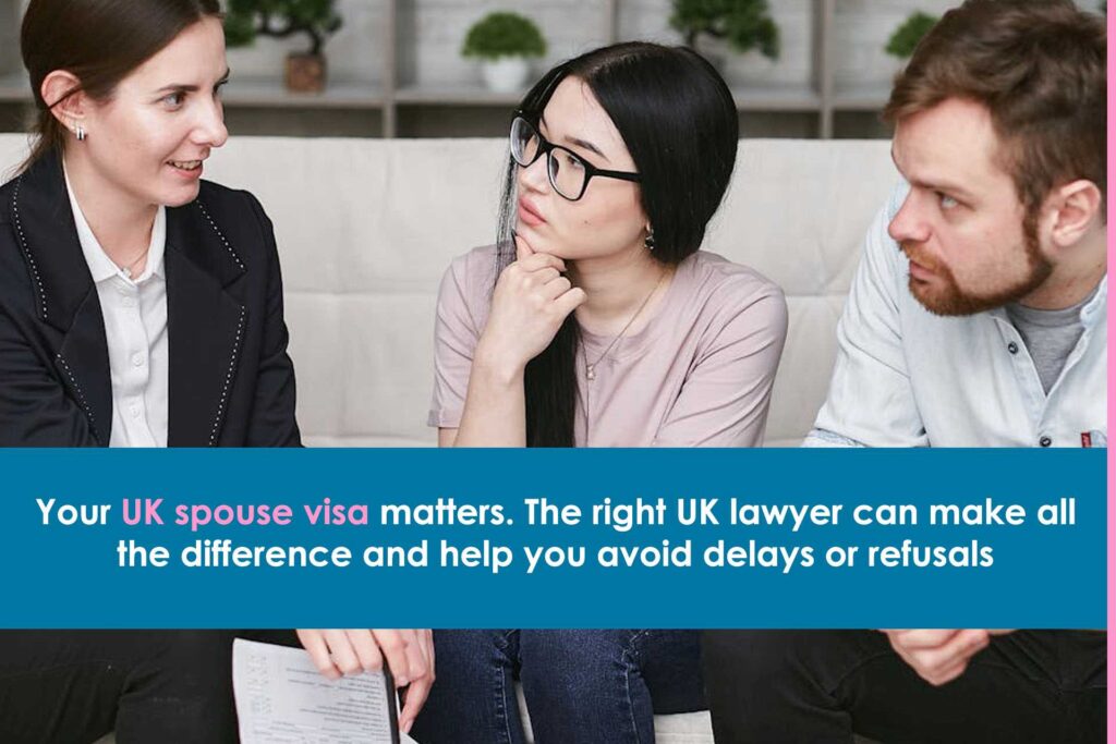 Immigration lawyer advising clients in an office about a UK spouse visa application.