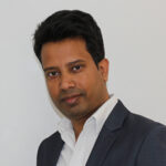 Sayed Ullah, Director at Mulgrave Law, standing in the office.